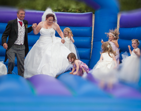 Bouncy castle time for the bride, groom and bridesmaids